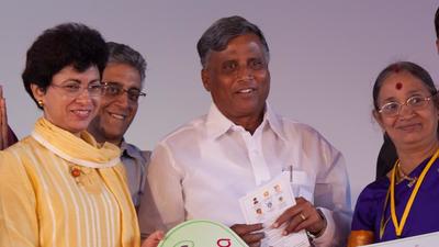 Karnataka minister V Somanna (centre) on Wednesday reviewed the infrastructure development department and held discussions with railway officials regarding the languishing projects. (Mint)