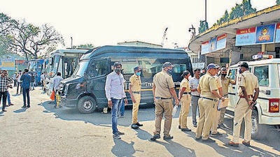 Police security at Swargate ST stand after government allowed private buses to pick up passengers from Swarget ST stand as state transport employees on strike. (Ravindra Joshi/HT PHOTO)