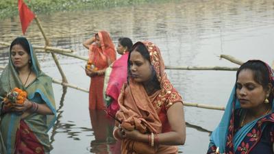 Women devotees perform rituals on the occasion of Chathh Puja on the banks of Hindon river in Ghaziabad on Wednesday. (Sakib Ali/HT photo) Women devotees perform rituals on the occasion of Chathh Puja on the banks of Hindon river in Ghaziabad on Wednesday. (Sakib Ali/HT photo)