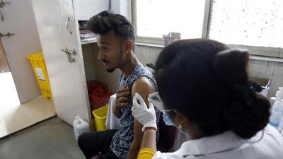 A beneficiary gets vaccine jab in Pune on Wednesday. As of Wednesday, Pune district has reported 241 new Covid-19 cases and three deaths due to the infection. (PRATHAM GOKHALE/HT)