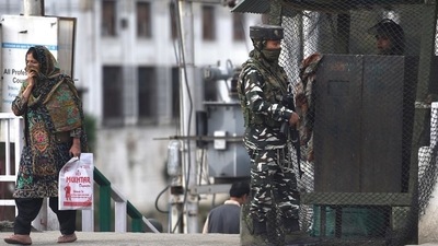 Security personnel stand guard at a checkpoint in Srinagar. (PTI) Security personnel stand guard at a checkpoint in Srinagar. (PTI)