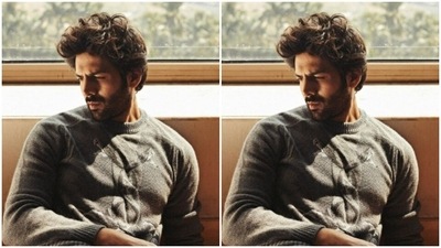 Kartik paired a grey sweater with a pair of black jeans. (Instagram/@kartikaaryan) Kartik paired a grey sweater with a pair of black jeans. (Instagram/@kartikaaryan)