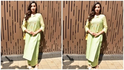 Nora's suit set came in a soothing green shade and featured an oversized cotton kurta. It was adorned with intricate floral embroidery, in yellow, white and pink shades, on the neckline and the long sleeves. A tassel-adorned tie on the front elevated the entire look. (HT Photo/Varinder Chawla) Nora's suit set came in a soothing green shade and featured an oversized cotton kurta. It was adorned with intricate floral embroidery, in yellow, white and pink shades, on the neckline and the long sleeves. A tassel-adorned tie on the front elevated the entire look. (HT Photo/Varinder Chawla)