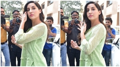 Nora paired the outfit with a yellow mini handbag and embellished white juttis. She left her silky mane open in a side parting, and for glam, opted for pink lip shade, glowing skin, blushed cheeks, winged eyeliner, and mascara-adorned eyelashes. (HT Photo/Varinder Chawla) Nora paired the outfit with a yellow mini handbag and embellished white juttis. She left her silky mane open in a side parting, and for glam, opted for pink lip shade, glowing skin, blushed cheeks, winged eyeliner, and mascara-adorned eyelashes. (HT Photo/Varinder Chawla)