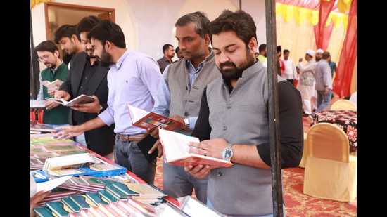 People browse through books at the book fair organised at the Islamic Centre of India, Aishbagh (HT Photo)