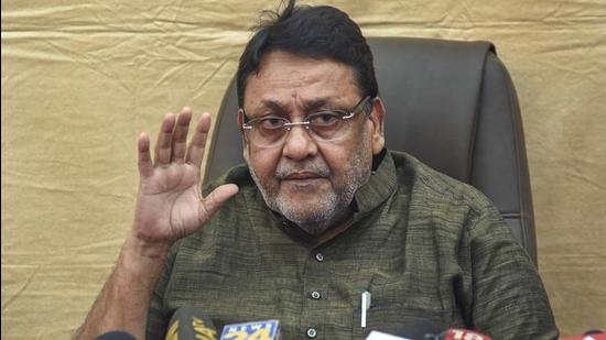 Sameer Wankhede’s father has sought an ad-interim injunction order against Nawab Malik from making further remarks or statements in media. The Bombay high court (HC) on Wednesday directed Nationalist Congress Party (NCP) leader Nawab Malik to file an affidavit to the effect that he had verified the information pertaining to Narcotics Control Bureau (NCB) zonal director Sameer Wankhede and his family, before publishing it on his Twitter handle (PTI) Sameer Wankhede’s father has sought an ad-interim injunction order against Nawab Malik from making further remarks or statements in media. The Bombay high court (HC) on Wednesday directed Nationalist Congress Party (NCP) leader Nawab Malik to file an affidavit to the effect that he had verified the information pertaining to Narcotics Control Bureau (NCB) zonal director Sameer Wankhede and his family, before publishing it on his Twitter handle (PTI)