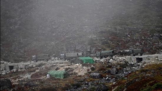 A convoy of Indian Army trucks drive along a road to Tawang, near the Line of Actual Control (LAC), neighbouring China, near Sela Pass in India's Arunachal Pradesh state on October 21. (AFP) A convoy of Indian Army trucks drive along a road to Tawang, near the Line of Actual Control (LAC), neighbouring China, near Sela Pass in India's Arunachal Pradesh state on October 21. (AFP)