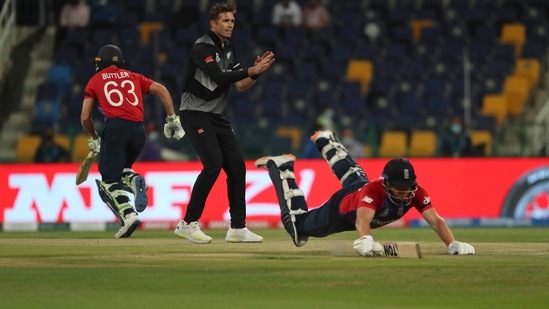 New Zealand's Tim Southee reacts as England's Jonny Bairstow dives to make it to the crease the Cricket Twenty20 World Cup semi-final match between England and New Zealand in Abu Dhabi, UAE, Wednesday, Nov. 10, 2021. (AP Photo/Aijaz Rahi)(AP)