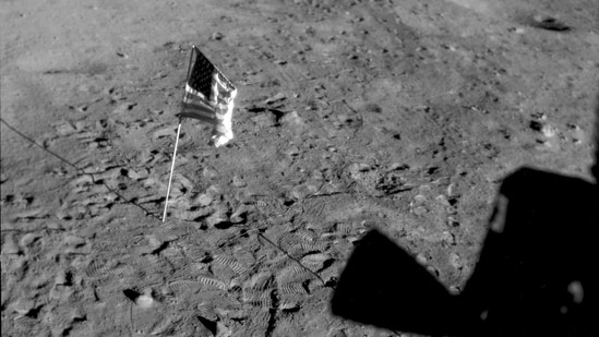 This July 21, 1969 photo made available by Nasa shows a US flag planted at Tranquility Base on the surface of the moon, and a silhouette of a thruster at right seen from a window of the lunar module.&nbsp;(File Photo / AP)