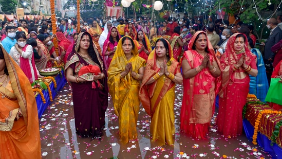 In the evening, all the vratis and their family members head to ghat of rivers or ponds that are decorated in advance for the puja offering. (PTI/Vijay Verma)
