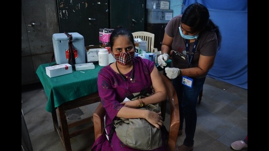 A resident gets her vaccination against Covid in Thane. (PRAFUL GANGURDE/HT FILE PHOTO)