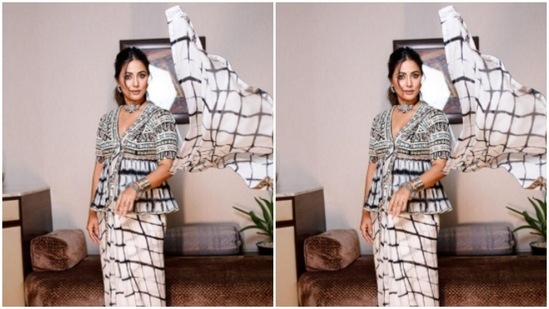 Styled by makeup artist Sachin Salvi, Hina opted for a minimal makeup look. In nude eyeshadow, mascara-laden eyelashes, drawn eyebrows, contoured cheeks and a nude shade of lipstick, Hina was ready to go.(Instagram/@realhinakhan)