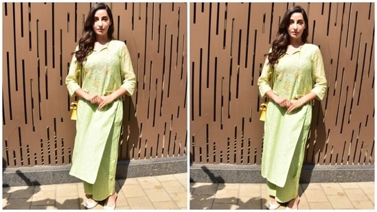 Nora's suit set came in a soothing green shade and featured an oversized cotton kurta. It was adorned with intricate floral embroidery, in yellow, white and pink shades, on the neckline and the long sleeves. A tassel-adorned tie on the front elevated the entire look.(HT Photo/Varinder Chawla)