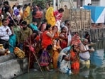 A large number of devotees across Delhi, West Bengal, Maharasthra, Jharkhand, Bihar and other Indian states offered 'Suryoday Arag' to Surya Dev on the last day of the four-day-long Chhath puja festival. In this photo, devotees can be seen worshipping the Sun God at a pond in Kolkata on the last day of the festival.(REUTERS)