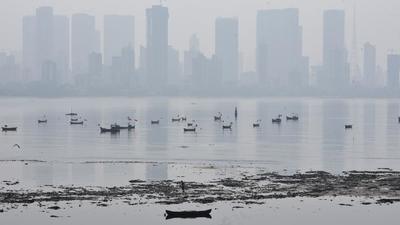 A minimum temperature in Mumbai have remained below normal for the past two days, and is likely to stay below normal through the weekend, the India Meteorological Department (IMD) officials have said. This was down from 21.4 degrees Celsius a day earlier, and 23.4 degrees Celsius on Monday. (HT PHOTO) A minimum temperature in Mumbai have remained below normal for the past two days, and is likely to stay below normal through the weekend, the India Meteorological Department (IMD) officials have said. This was down from 21.4 degrees Celsius a day earlier, and 23.4 degrees Celsius on Monday. (HT PHOTO)