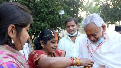 Bihar CM Nitish Kumar being offered prasad on the occasion of Chhath Puja, in Patna on Thursday. (Santosh Kumar/HT Photo) Bihar CM Nitish Kumar being offered prasad on the occasion of Chhath Puja, in Patna on Thursday. (Santosh Kumar/HT Photo)
