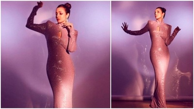Malaika Arora redefines elegance in this rose gold body-hugging gown with a small cut-out on the chest. (Instagram/@manekaharisinghani) Malaika Arora redefines elegance in this rose gold body-hugging gown with a small cut-out on the chest. (Instagram/@manekaharisinghani)
