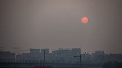 The sun rises over buildings shrouded in smog in New Delhi. (Bloomberg) The sun rises over buildings shrouded in smog in New Delhi. (Bloomberg)