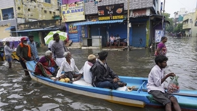 People travel on a boat in floodwaters on the outskirts of Chennai on Wednesday. (AP Photo) People travel on a boat in floodwaters on the outskirts of Chennai on Wednesday. (AP Photo)