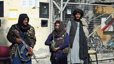 Taliban fighters stand guard at an entrance gate of the Sardar Mohammad Dawood Khan military hospital in Kabul on November 3, 2021.&nbsp; (AFP Photo)