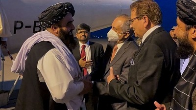 Taliban's acting foreign minister Amir Khan Muttaqi (left) is received by Pakistan's commerce advisor Abdul Razak Dawood (wearing mask), upon his arrival in Islamabad on Wednesday. (AFP Photo) Taliban's acting foreign minister Amir Khan Muttaqi (left) is received by Pakistan's commerce advisor Abdul Razak Dawood (wearing mask), upon his arrival in Islamabad on Wednesday. (AFP Photo)