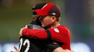 New Zealand captain Kane Williamson and England captain Eoin Morgan embrace after the match&nbsp; (REUTERS)