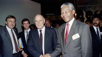 Nelson Mandela (R) greets then South Africa's President F. W. De Klerk. (AFP / File)