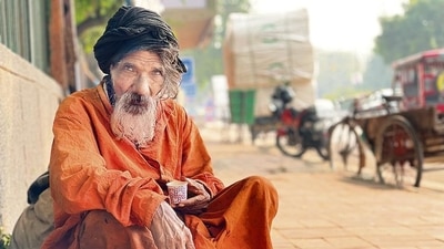 Manglu, as he introduces himself, is sitting down on a central Delhi pavement, near the Ashram flyover. (Mayank Austen Soofi) Manglu, as he introduces himself, is sitting down on a central Delhi pavement, near the Ashram flyover. (Mayank Austen Soofi)