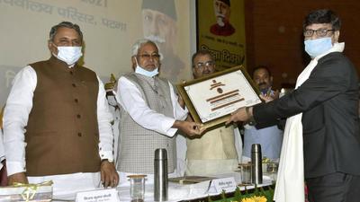 Bihar CM Nitish Kumar presents state’s highest award in the field of education, Maulana Abul KalamAzad Shiksha Puruskar, 2021, to Dr Shankar Nath Jha, in Patna on Thursday. (Santosh Kumar/HT Photo) Bihar CM Nitish Kumar presents state’s highest award in the field of education, Maulana Abul KalamAzad Shiksha Puruskar, 2021, to Dr Shankar Nath Jha, in Patna on Thursday. (Santosh Kumar/HT Photo)