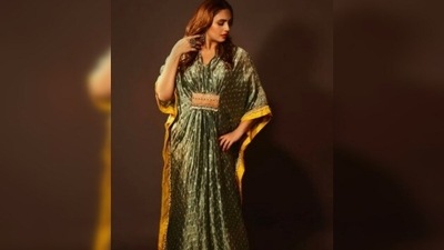 Huma Qureshi keeps it comfy yet stylish in this stunning metallic green Kaftan with yellow borders. (Instagram/@iamhumaq) Huma Qureshi keeps it comfy yet stylish in this stunning metallic green Kaftan with yellow borders. (Instagram/@iamhumaq)