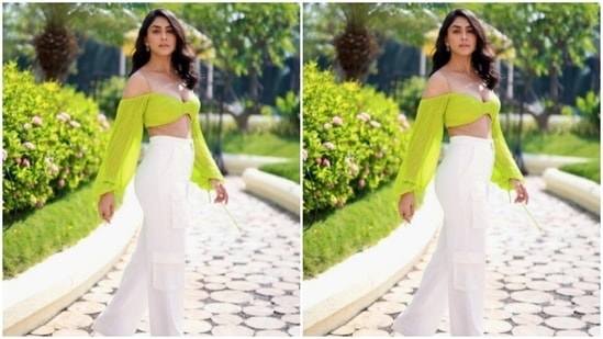 Mrunal decked up in a neon green cropped top with dramatic sleeves, designed by the designer house Antithesis.(Instagram/@mrunalthakur)