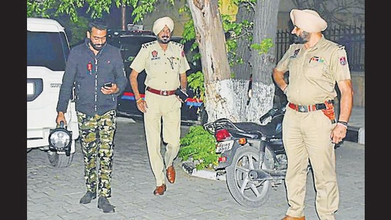 A member of the bomb disposal team and cops at Sarabha Nagar in Ludhiana on Thursday. (Harsimar Pal Singh/HT) A member of the bomb disposal team and cops at Sarabha Nagar in Ludhiana on Thursday. (Harsimar Pal Singh/HT)