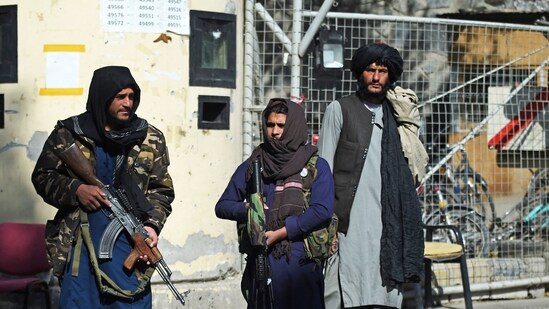 Taliban fighters stand guard at an entrance gate of the Sardar Mohammad Dawood Khan military hospital in Kabul on November 3, 2021.&nbsp;(AFP Photo)
