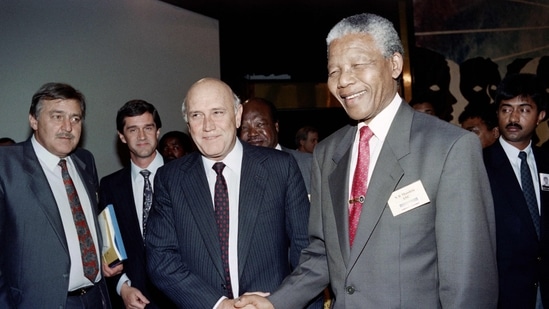 Nelson Mandela (R) greets then South Africa's President F. W. De Klerk. (AFP / File)