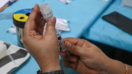 Right time for booster shots in India? Here's what AIIMS doctor has to say. (File image/Photo by Prakash SINGH / AFP)