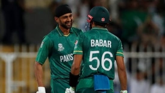 Pakistan's Shoaib Malik, left, celebrates with captain Babar Azam(AP)