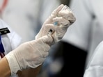 A healthcare worker fills a syringe with a dose of Bharat Biotech's Covid-19 vaccine called Covaxin,&nbsp;