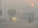 Commuters make their way amid smoggy conditions in Lahore. (Photo by Arif ALI / AFP) Commuters make their way amid smoggy conditions in Lahore. (Photo by Arif ALI / AFP)