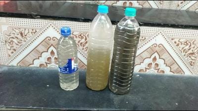 Bottles filled with muddy water that the residents of Khadegolavli area of Kalyan have been receiving for the last 10 days. (HT PHOTO) Bottles filled with muddy water that the residents of Khadegolavli area of Kalyan have been receiving for the last 10 days. (HT PHOTO)