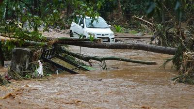 A stranded car is seen during a flashflood in Thodupuzha, Kerala last month. The deadly 2018 deluge in the state is back in the news after a CAG report has pointed to flaws in the state’s preparedness for the floods at that time. (AFP/File) A stranded car is seen during a flashflood in Thodupuzha, Kerala last month. The deadly 2018 deluge in the state is back in the news after a CAG report has pointed to flaws in the state’s preparedness for the floods at that time. (AFP/File)