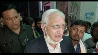 Congress leader Salman Khursheed after meeting custodial death victim Altaf’s family in Kasganj on Friday. (HT)