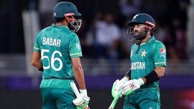 Pakistan's captain Babar Azam, left, and Mohammad Rizwan speak between overs during the Cricket Twenty20 World Cup semi-final match between Pakistan and Australia in Dubai, UAE, Thursday, Nov. 11, 2021. (AP) Pakistan's captain Babar Azam, left, and Mohammad Rizwan speak between overs during the Cricket Twenty20 World Cup semi-final match between Pakistan and Australia in Dubai, UAE, Thursday, Nov. 11, 2021. (AP)