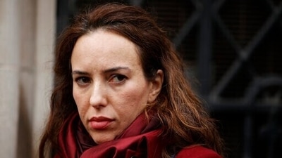 Stella Moris, partner of Julian Assange, waits outside the High Court in London. (AP)