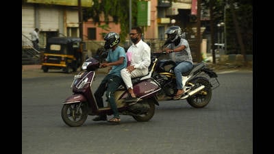 Navi Mumbai traffic police have intensified their drive against riding without helmets. (For representational purposes only) (BACHCHAN KUMAR/HT PHOTO) Navi Mumbai traffic police have intensified their drive against riding without helmets. (For representational purposes only) (BACHCHAN KUMAR/HT PHOTO)
