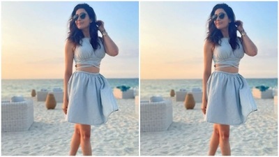 Karishma paired it with a pleated short skirt of the same colour as she posed for the pictures. (Instagram/@karishmaktanna) Karishma paired it with a pleated short skirt of the same colour as she posed for the pictures. (Instagram/@karishmaktanna)
