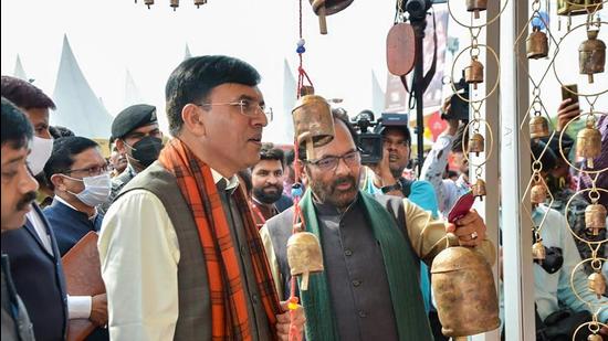 Union ministers Mansukh Mandaviya and Mukhtar Abbas Naqvi during the inauguration of the 32nd Hunar Haat in Lucknow on Friday. (PTI Photo)