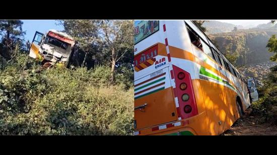 The private bus ferrying tourists from Gujarat from Manali to Dharamshala met with an accident in Kangra district of Himachal Pradesh on Friday morning. The bus was stopped from rolling down the hill by a tree. (HT Photo)