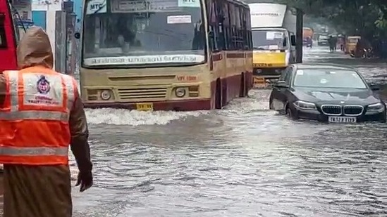 Vehicles ply through a waterlogged street in Chennai on Thursday. Rainwater entered state-run hospitals in KK Nagar and Chromepet prompting authorities to shift patients to other facilities.(ANI)