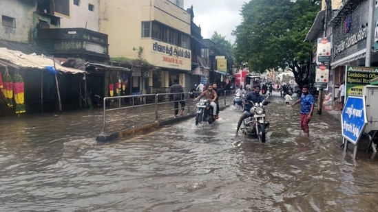 Chennai, Nov 11 (ANI): Vehicles wade through a waterlogged road following heavy rainfall, in Chennai on Thursday. (ANI Photo)(ANI)