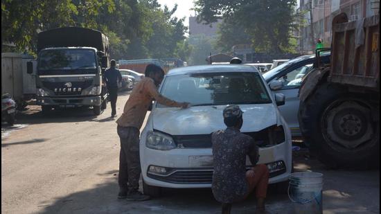 At the Motor Market, there is no space left for pedestrians as most of the times mechanics repair vehicles on the road.